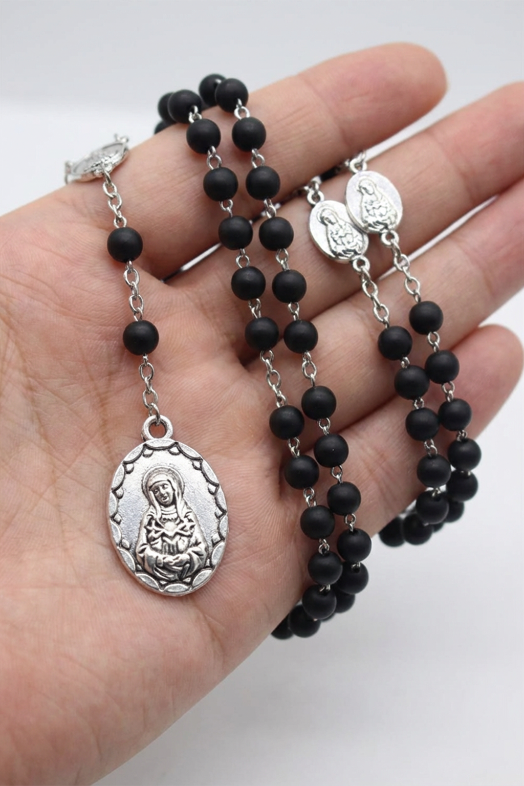 Rosary in virgin wood Mary